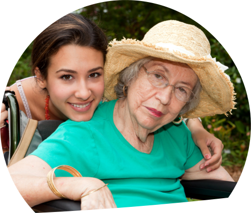 elder on a wheelchair with caregiver